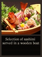 Selection of sashimi served in a wooden boat